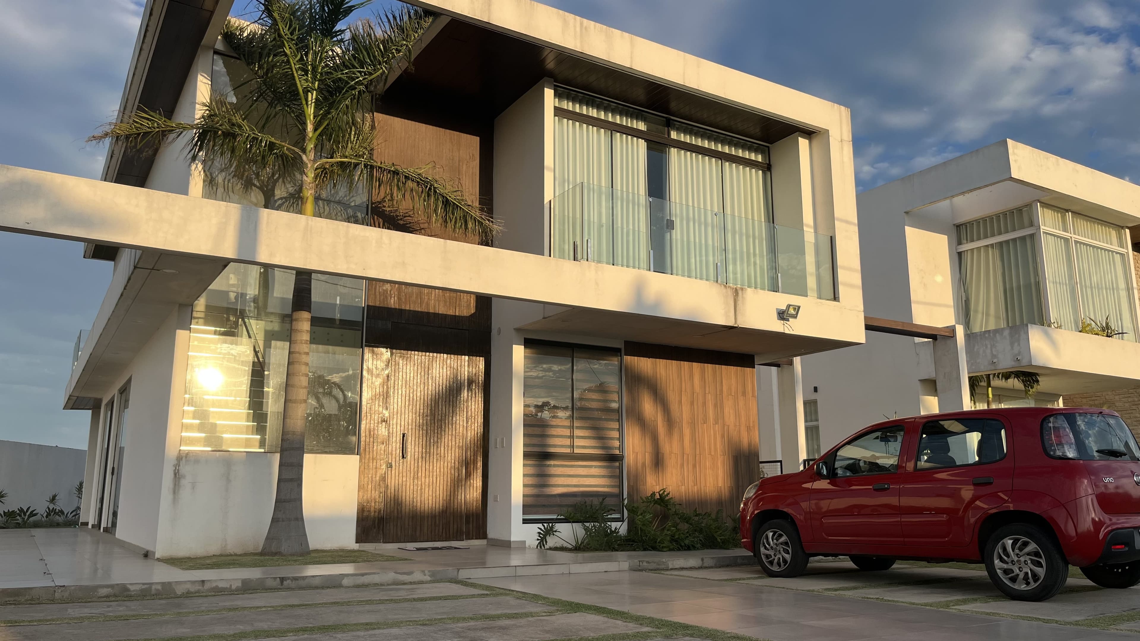 The front of Davezies House at golden hour