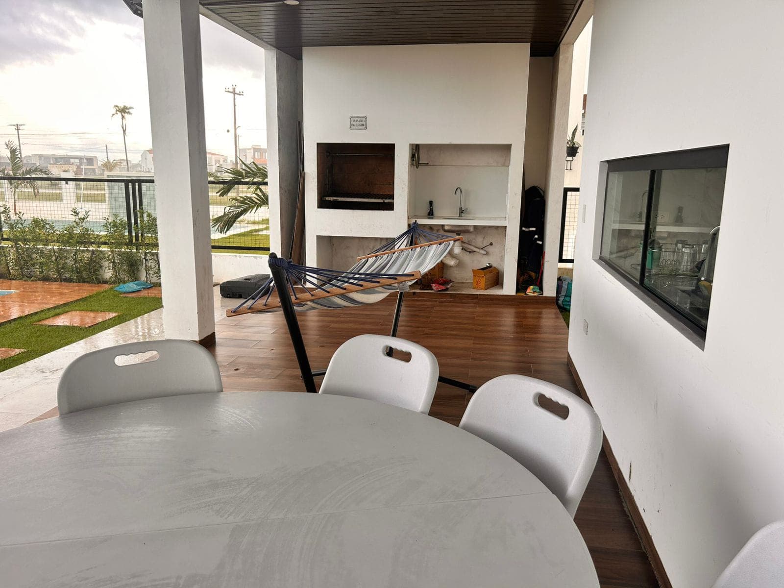 The outdoor grilling table set up for an asado at Davezies House