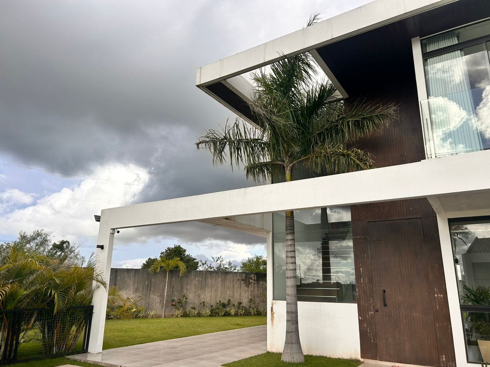 Davezies House's exterior under a dramatic sky