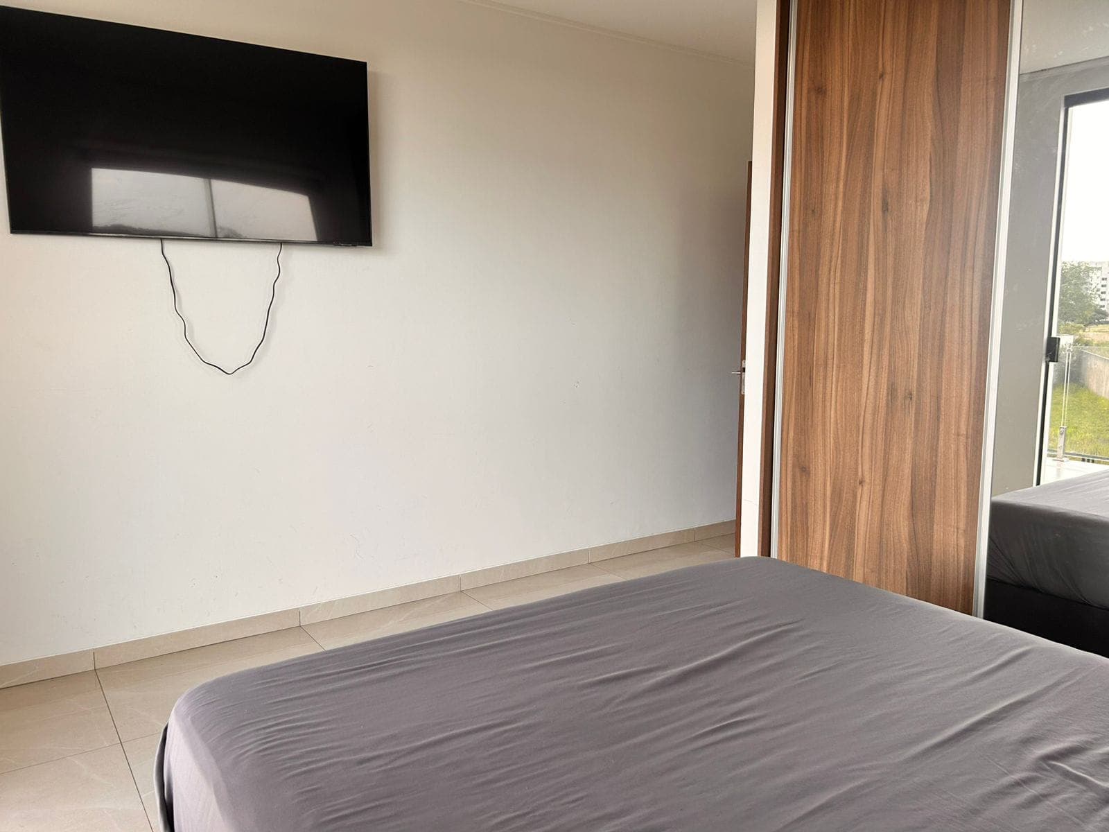 A bedroom's seating and TV area
